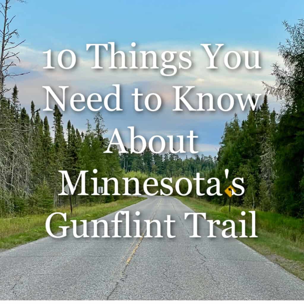 Weather paved road traveling through a forest at sunset. Text overlay reads "10 Things You Need to Know About Minnesota's Gunflint Trail"