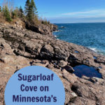 View looking down basalt rocks on Lake Superior's North Shore. Text overlay reads "Sugarloaf Cove on Minnesota's North Shore."