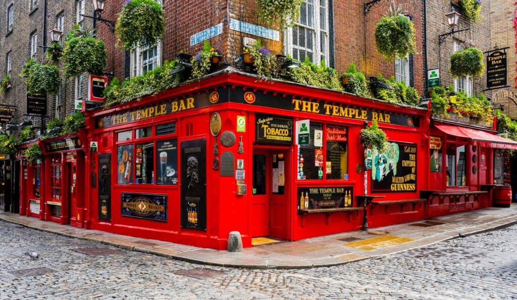 Red bar with foliage around the roof in the Temple Bar district of Dublin
