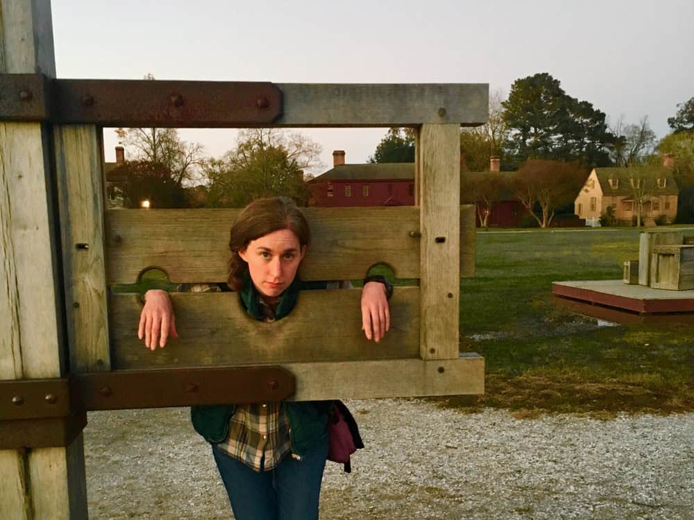Woman poses in a replica stockade
