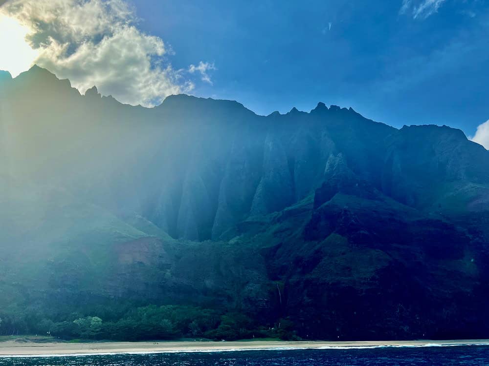 Shady view of Na Pali Coast cliffs