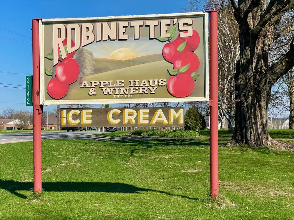Colorful sign with apples on it for Robinette's Apple Haus in Grand Rapids