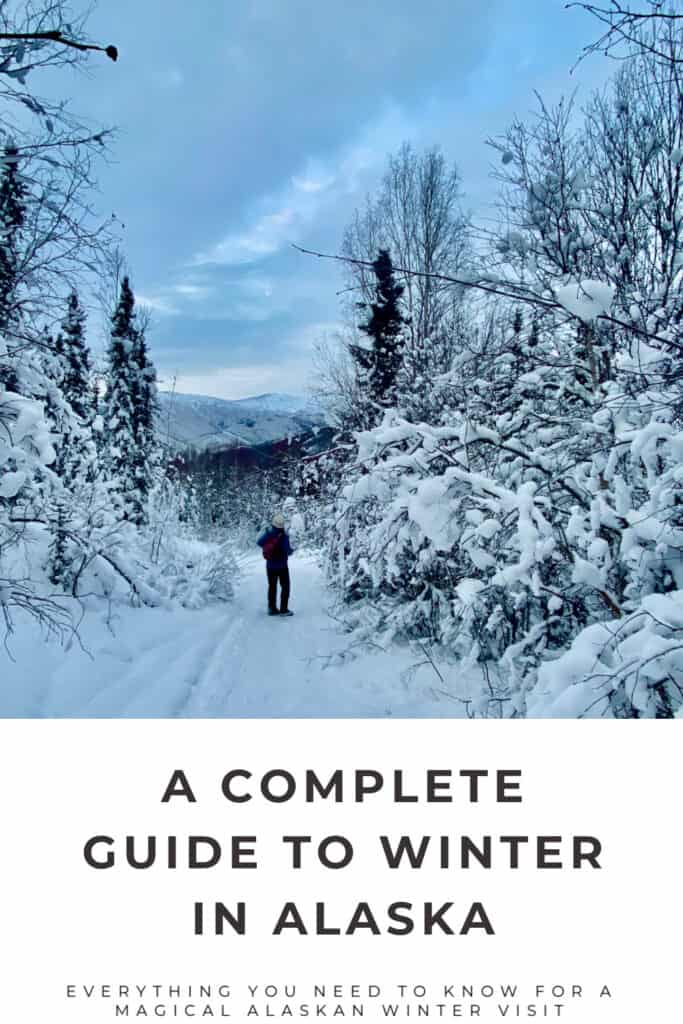 Woman walks in Alaskan snow flocked ice. Text reads "A Complete Guide to Winter in Alaska."