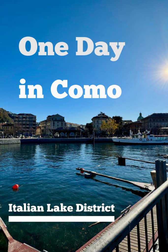 Looking across a pier on Lake Como to Como City. Text overlay reads "One Day in Come: Italian Lake District."