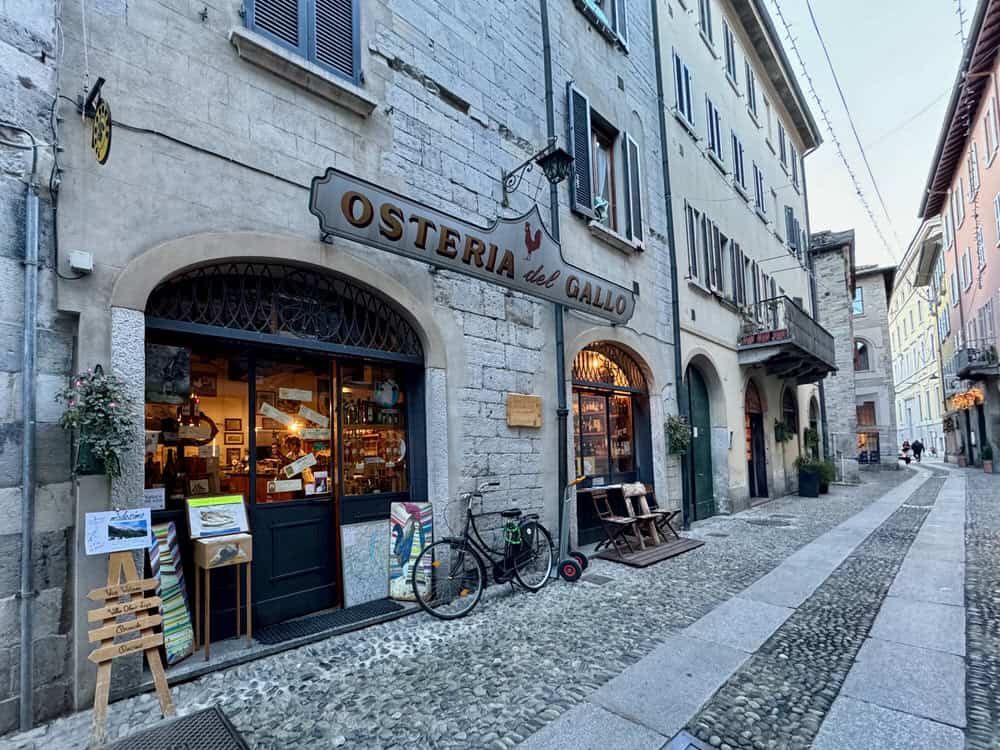 Exterior of osteria in Lake Como Italy on a medieval cobblestone street