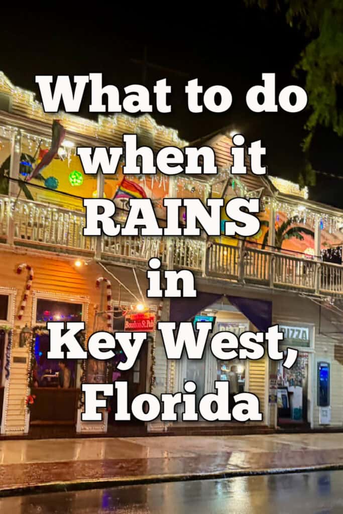 A brightly lit two story Duval Street shop after dark on a rainy night. Text reads "What to do when it rains in Key West, Florida."