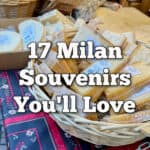 A selection of vacuum sealed northern Italian cheese sits in baskets on a tablecloth covered shelf. Text reads "16 Milan Souvenirs You'll Love"