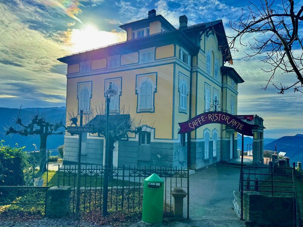 Yellow two story restaurant at the top of Lugano Switzerland's Monte Bre
