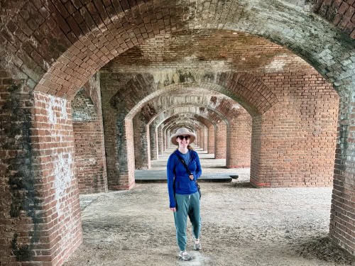Woman stands in the archways in Fort Jefferson on Florida's Dry Tortugas Islands