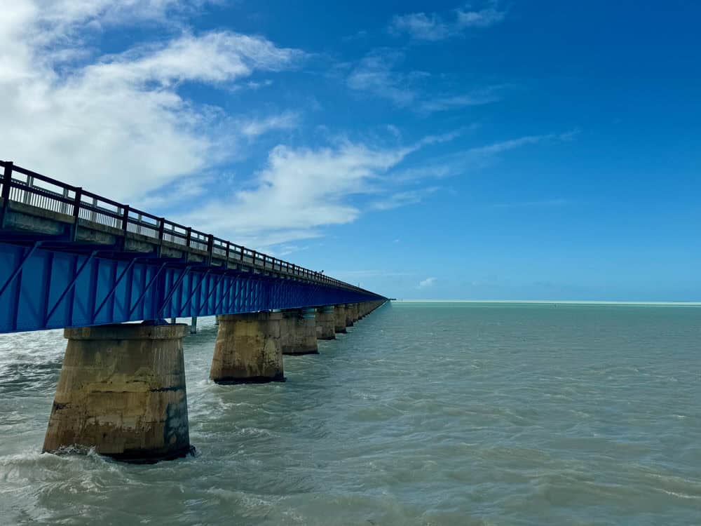 Blue steel and concrete bridge across an ocean channel