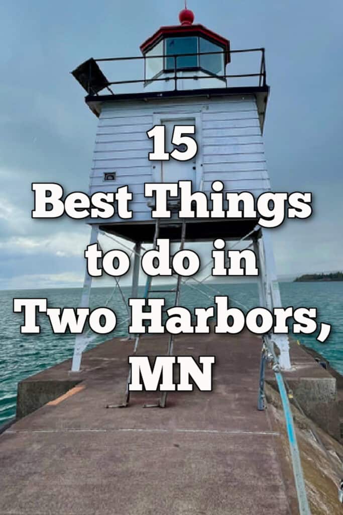 Lighthouse sits on top of a concrete breakwall. Text overlay reads "15 Best Things to do in Two Harbors MN"