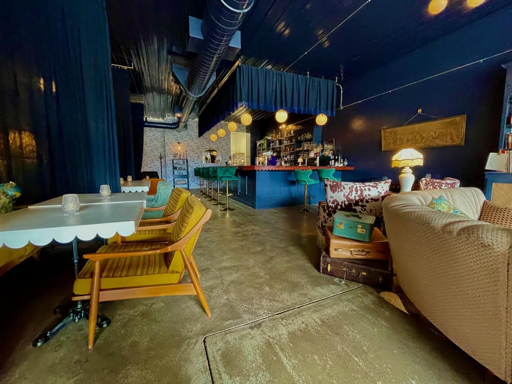 Interior of a lounge in downtown Two Harbors with vintage decor and ambiance lighting