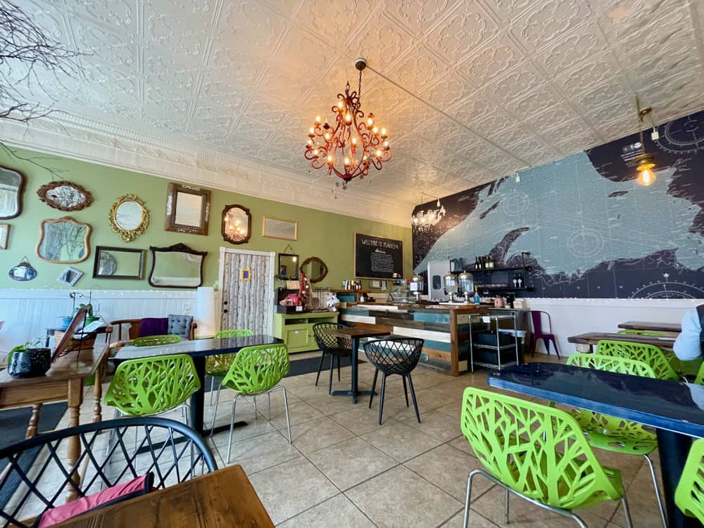 Interior of Maderia Bistro in Two Harbors with tin ceiling tiles, a wall of mirrors, and a massive map of Lake Superior