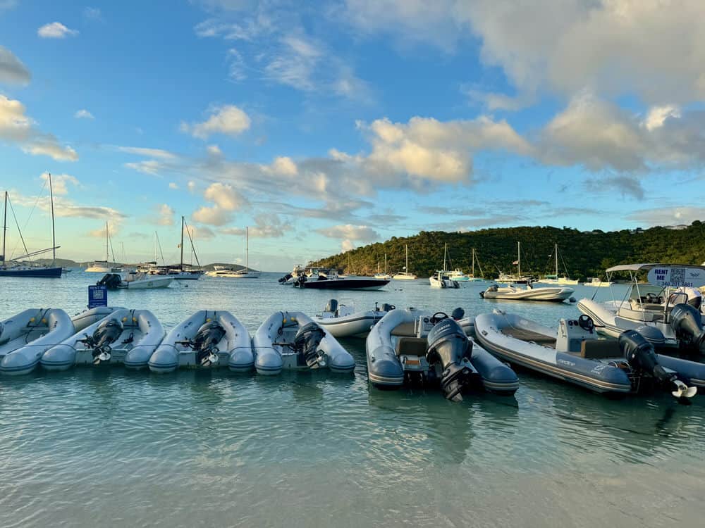 A row of dinghy boats anchored in the Caribbean sea in the U.S. Virgin Islands