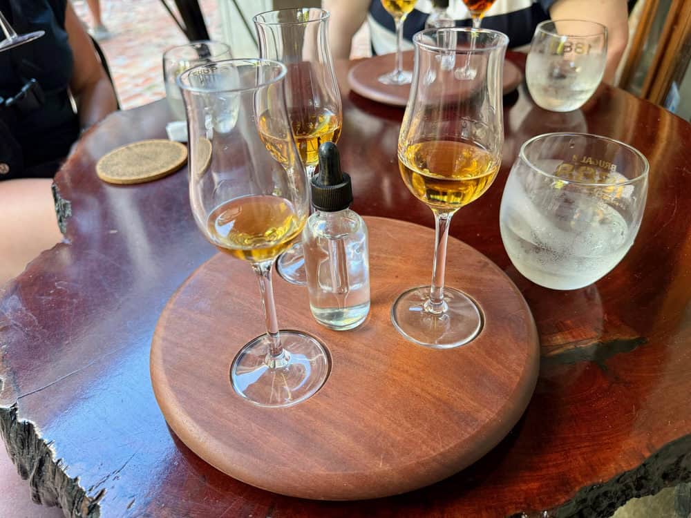 Glasses of rum and water on an outdoor table at Mongoose Junction in Cruz Bay St. John