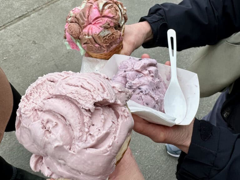 Customers hold out their ice cream cones from Snow Goose Produce in Skagit Valley.