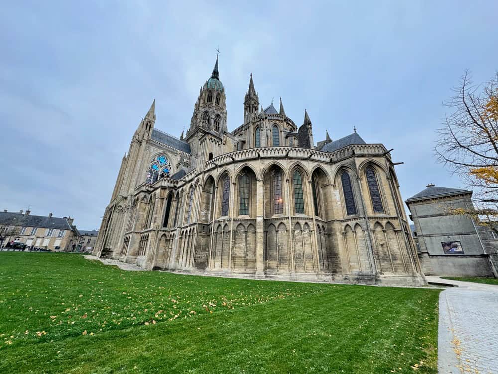 Large Norman-Romanesque cathedral in the middle of a French village.