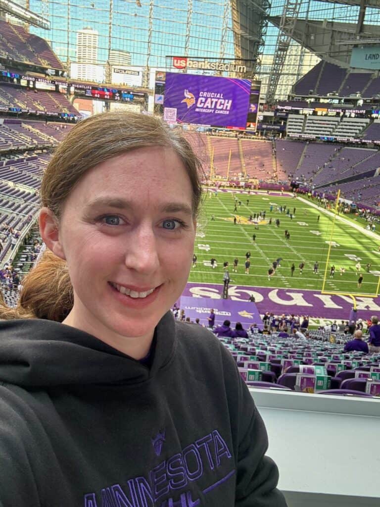 Selfie of a woman in front of the Vikings field in U.S. Bank Stadium, Minneapolis, MN