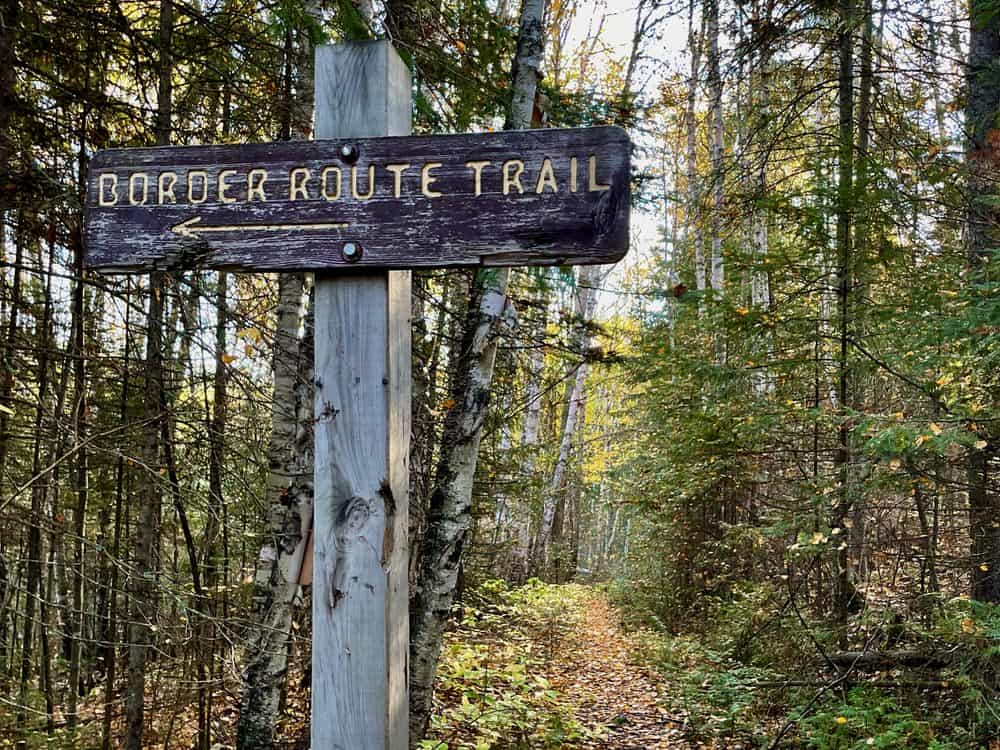 Weather trail sign at the intersection of the Border Route Trail in autumn