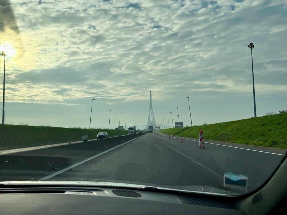 View through the windshield as a car drives towards the Pont de Normandie bridge in northern France.