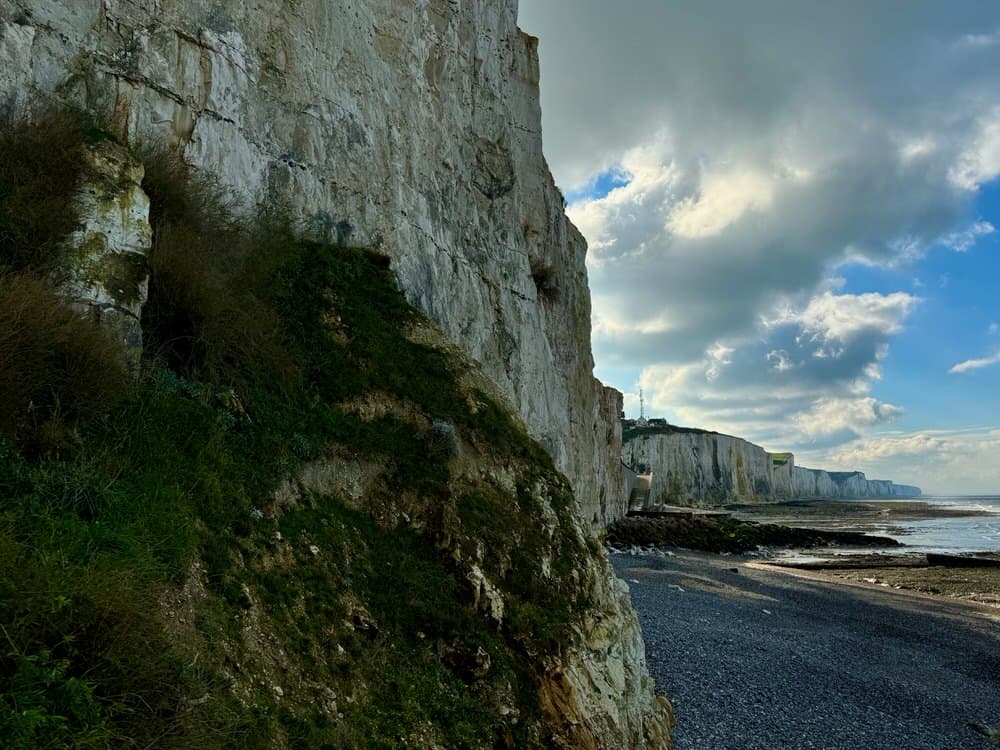 White chalk cliffs stretch into the horizon along the French coast near Ault