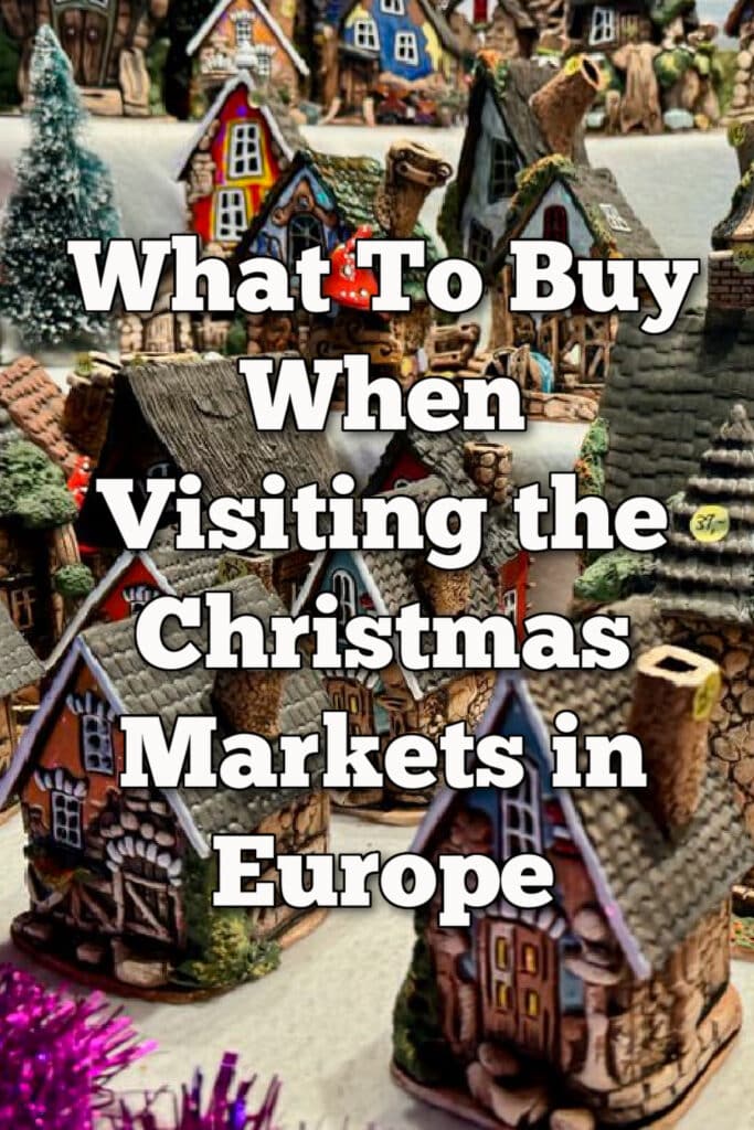 Close up of a small ceramic fairy houses at a Christmas market booth. Text overlay reads "What to buy when visiting the Christmas markets in Europe."