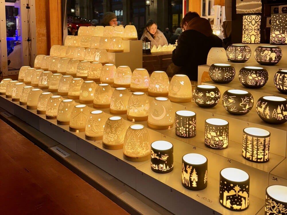 Rows of luminary candles in a Christmas market stand in Switzerland