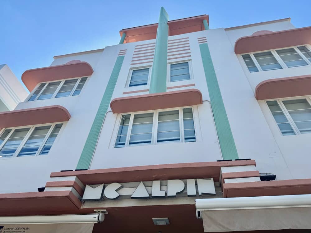 Coral and teal exterior of McAlpin art deco hotel in South Beach of Miami Beach
