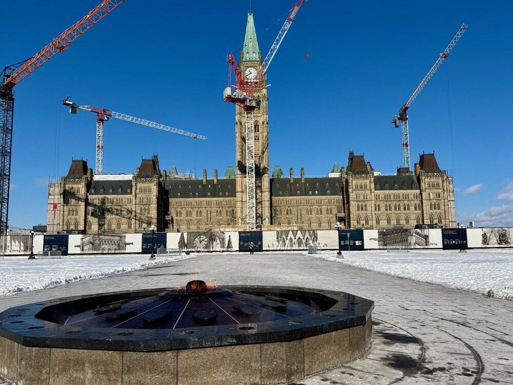 An eternal flame burns in front of the main Canada parliament building in Ottawa Ontario