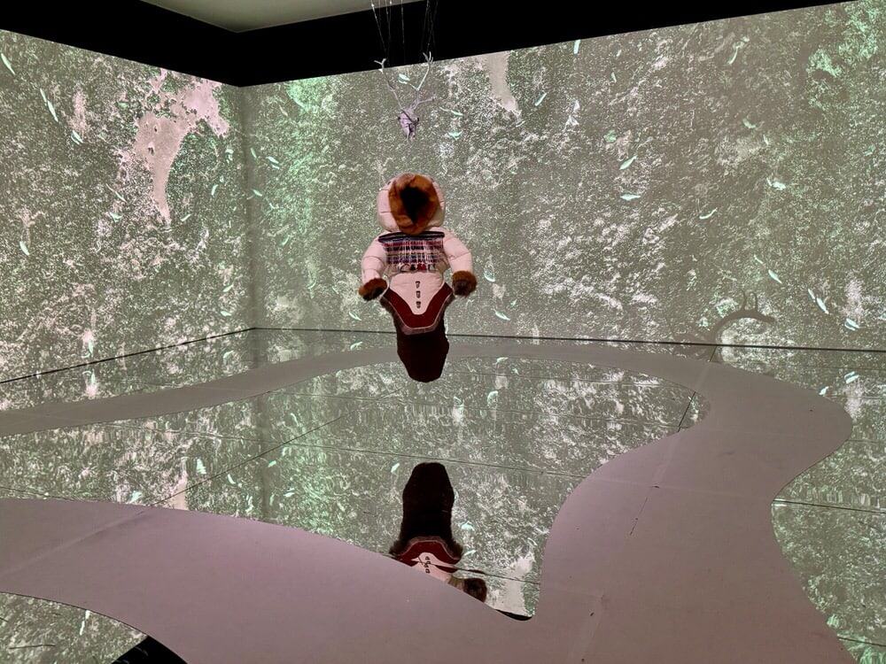 A native parka hangs in the center of a gallery room at the National Gallery of Canada