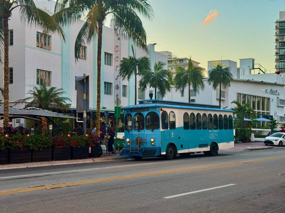 A Miami Beach trolley at a stop on Collins Avenue