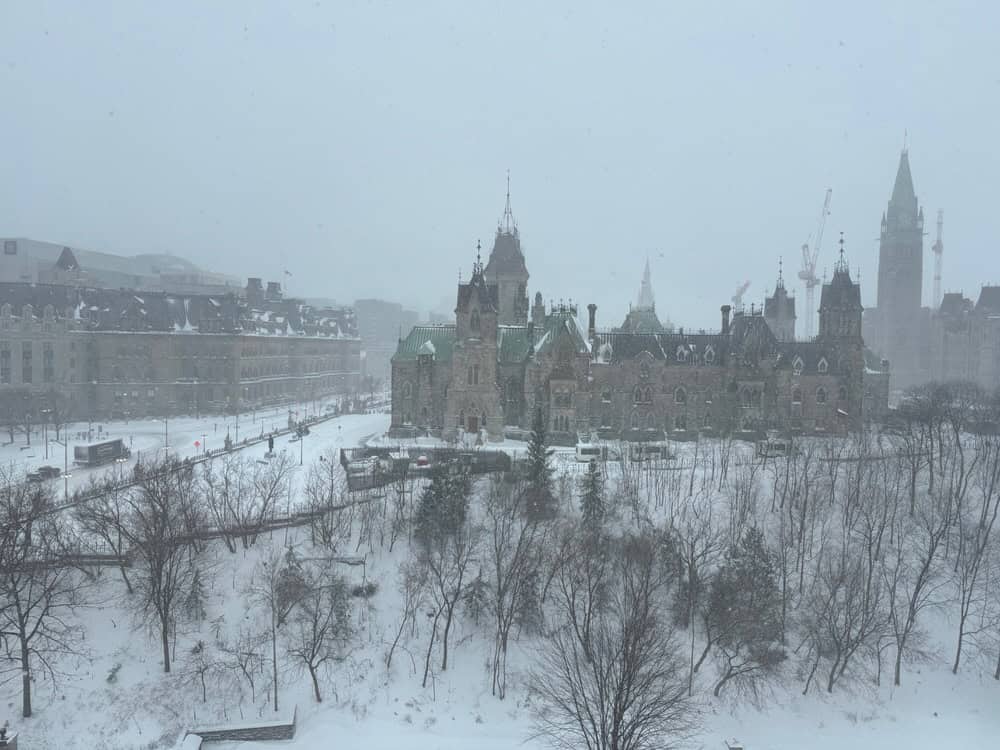 Snowy view of Parliament Hill in Ottawa Ontario during a blizzard