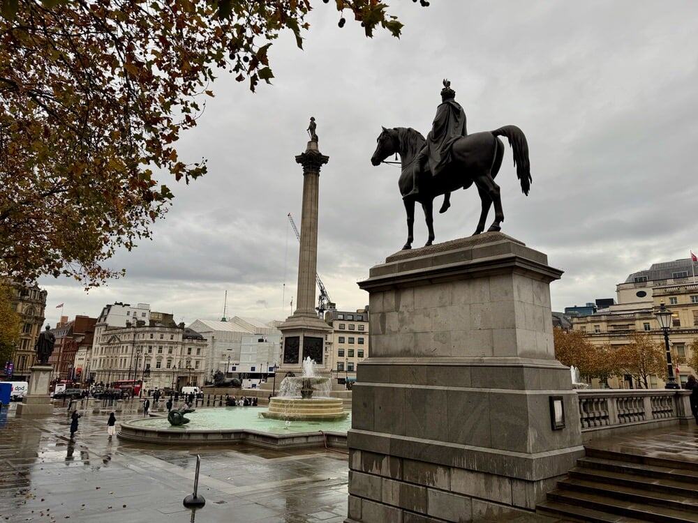 Looking down across Trafalgar Square towards the Nelson column and lion statues