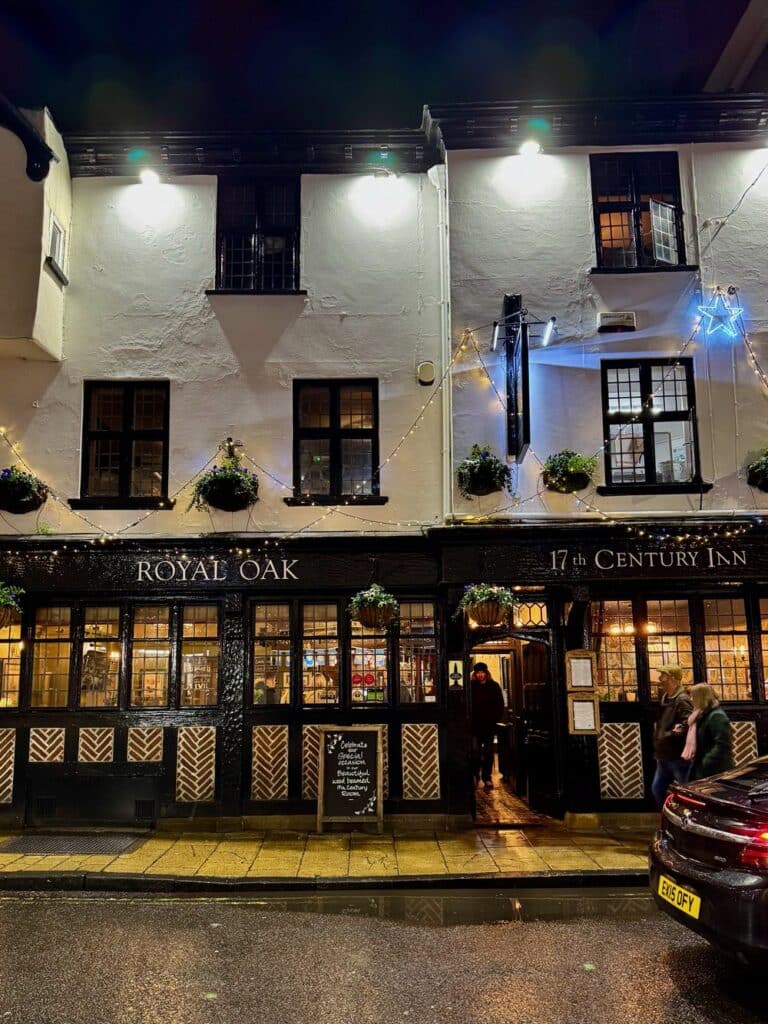 A white timber frame pub exterior