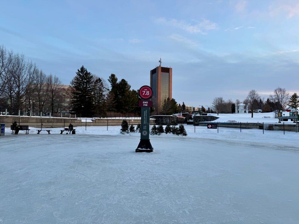 The finish point of the Rideau Canal is marked with a kilometer post in the middle of the ice by Carleton University.