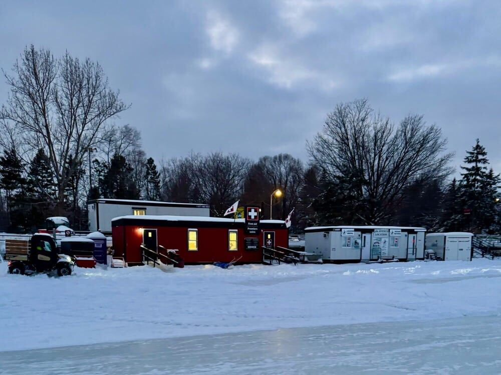 A red trailer on the ice of the Rideau Canal Skateway serves as the first aid station.