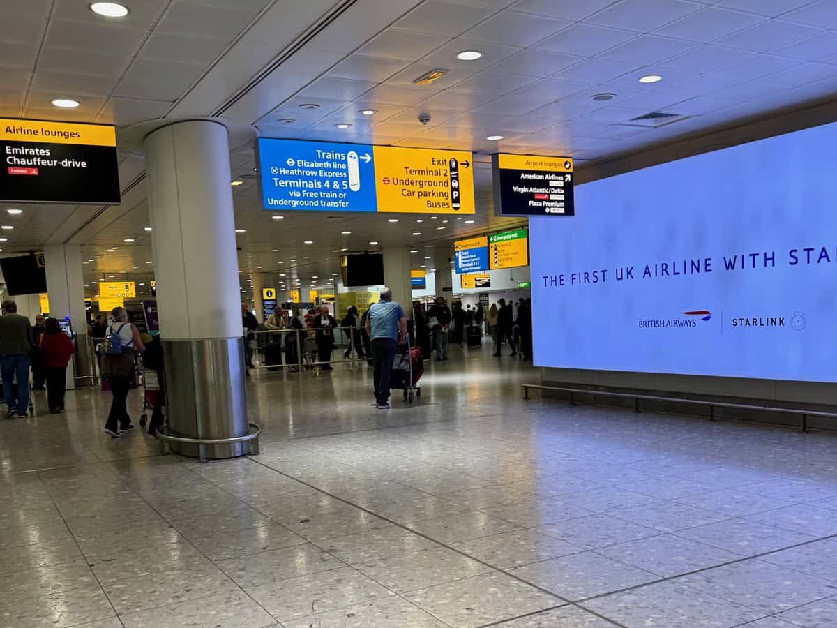 Bright directional signs inside of Heathrow airport in London