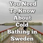 People walk on the causeway out to the kallbadhus in Malmo Sweden. Text overlay reads "Everything You need to know about cold bathing in Sweden."