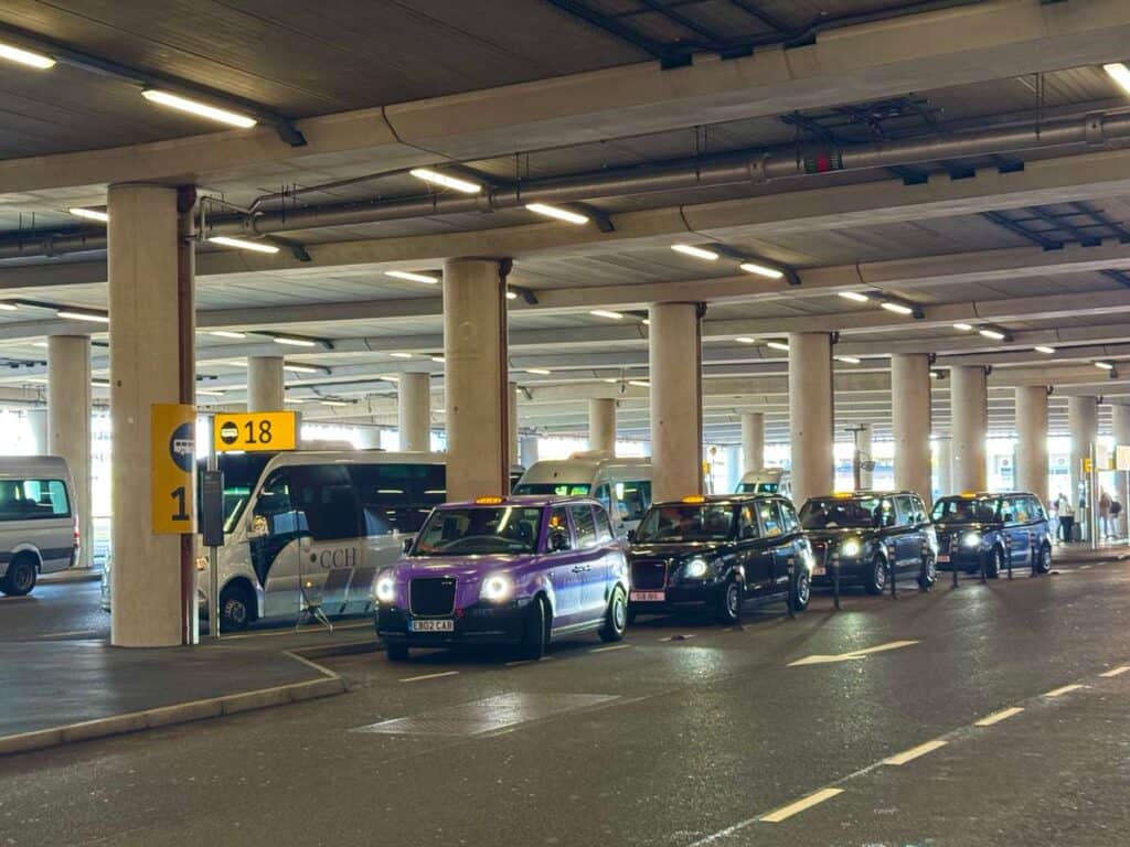 Taxis wait in a line at the taxi bay in Heathrow Terminals 2 &3