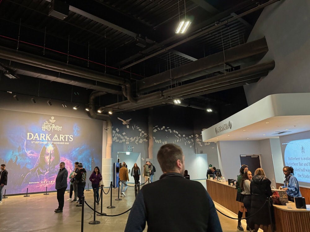 People mingle in the main lobby area of Warner Bros Studio Leavesden
