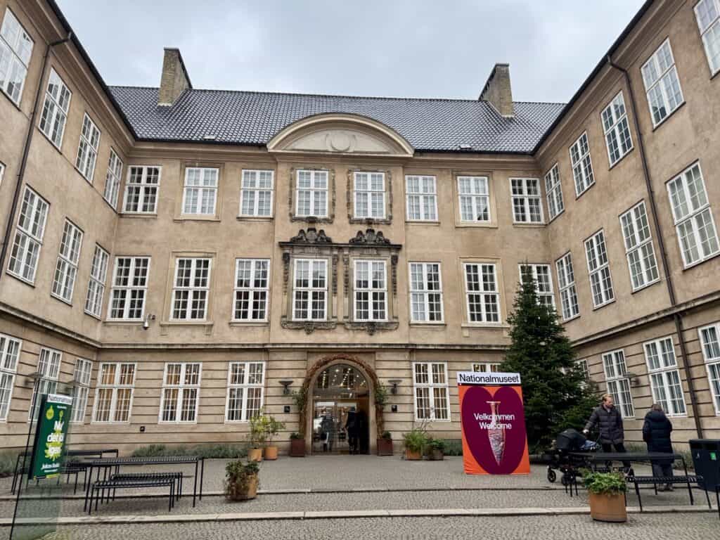 Courtyard entrance to a brick building with three stories