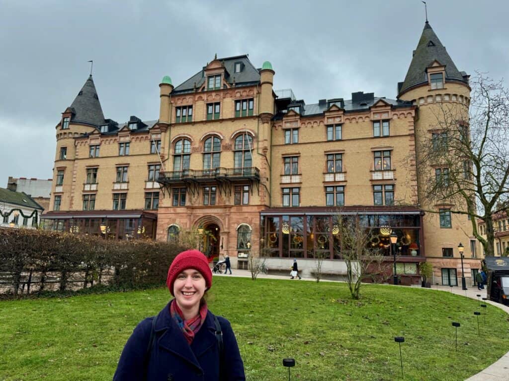 Woman poses outside of Grand Hotel in Lund Sweden