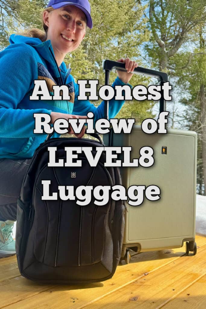 Woman poses with LEVEL8 suitcase and backpack. Text overlay reads "An Honest Review of LEVEL8 Luggage"