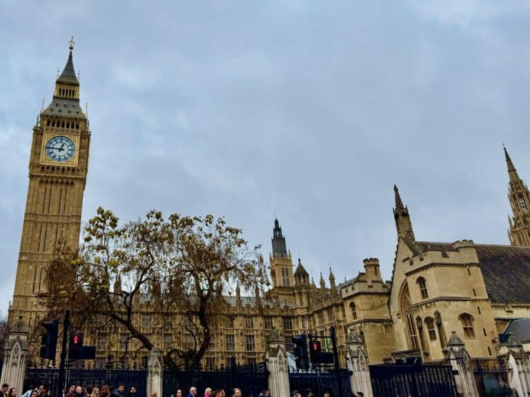 Westminster Houses of Parliament Clock Tower and Big Ben as seen from Parliament Square on a cloudy day