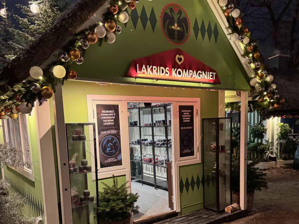 A festively decorated small holiday shop in the Tivoli Gardens Christmas market.