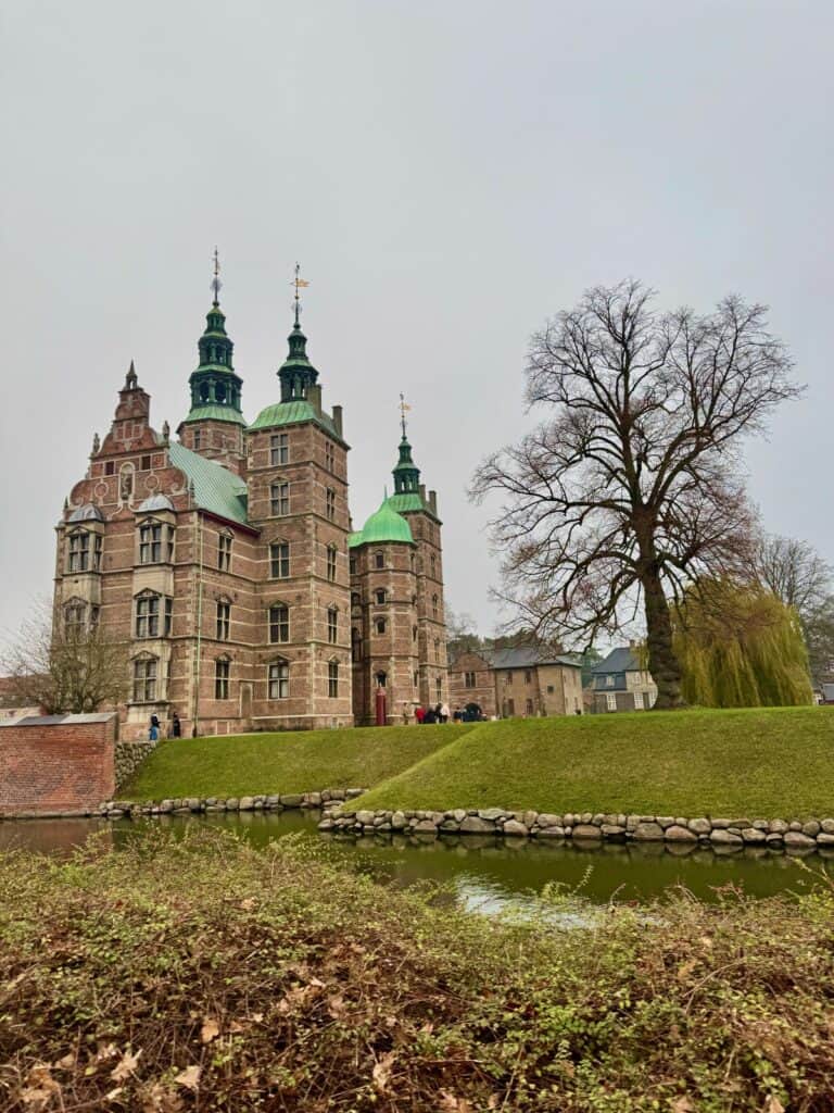 View of 17th century Rosenborg Castle exterior and moat in central Copenhagen as seen from the Kings Garden.