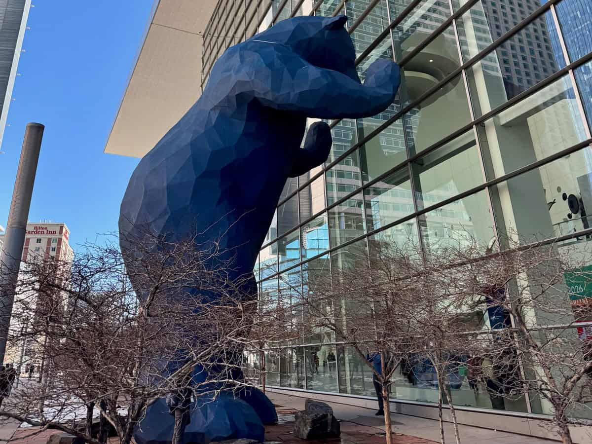 Giant blue bear statue peers into the Colorado Convention Center windows in Denver