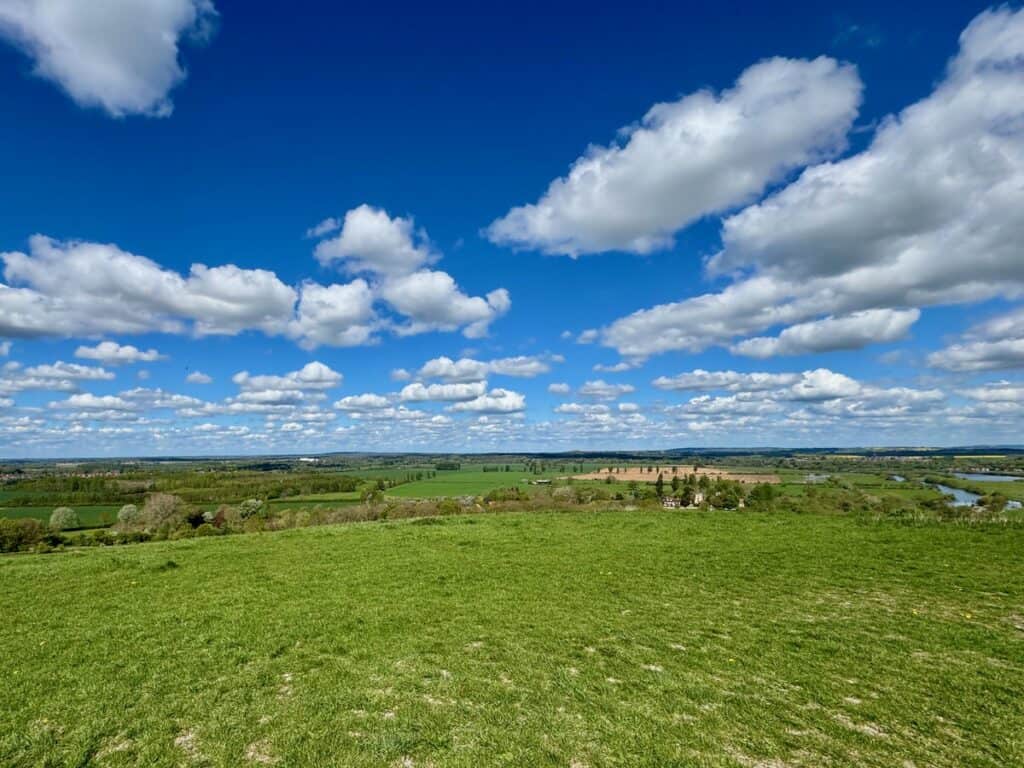 View across the Thames River Valley on a sunny spring day from the top of a hill in Wittenham Hills Nature Reserve
