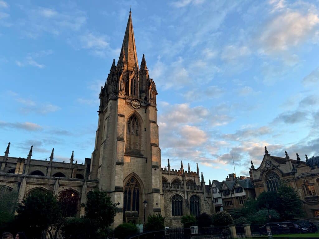 The medieval spire of Oxford University Church at sunset